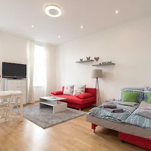 Bright Red Heart In Leopoldstadt Apartment